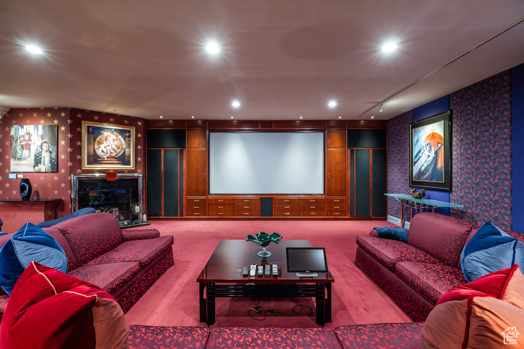 Home theater room with wallpapered walls, carpet floors, and recessed lighting