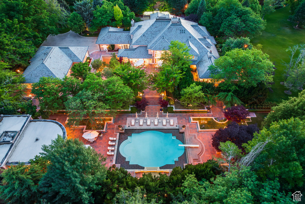 View of subject property with a pool