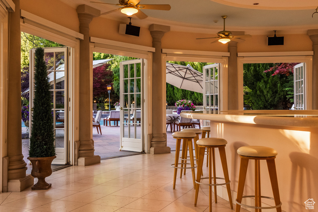 View of patio featuring ceiling fan