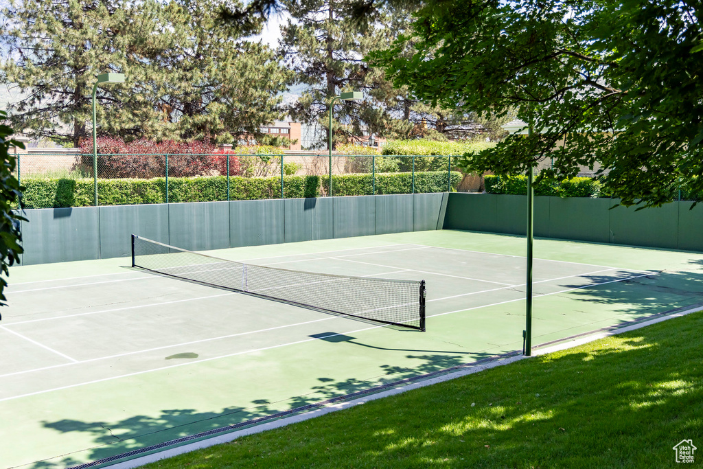 View of tennis court featuring community basketball court