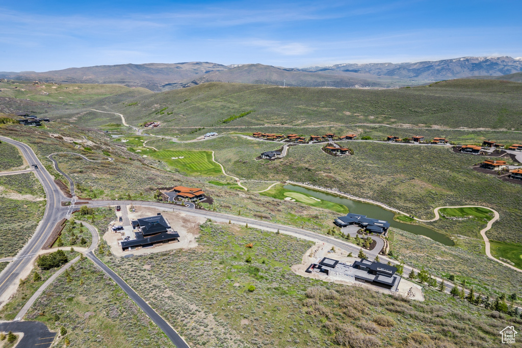 Aerial overview of property's location with a water and mountain view