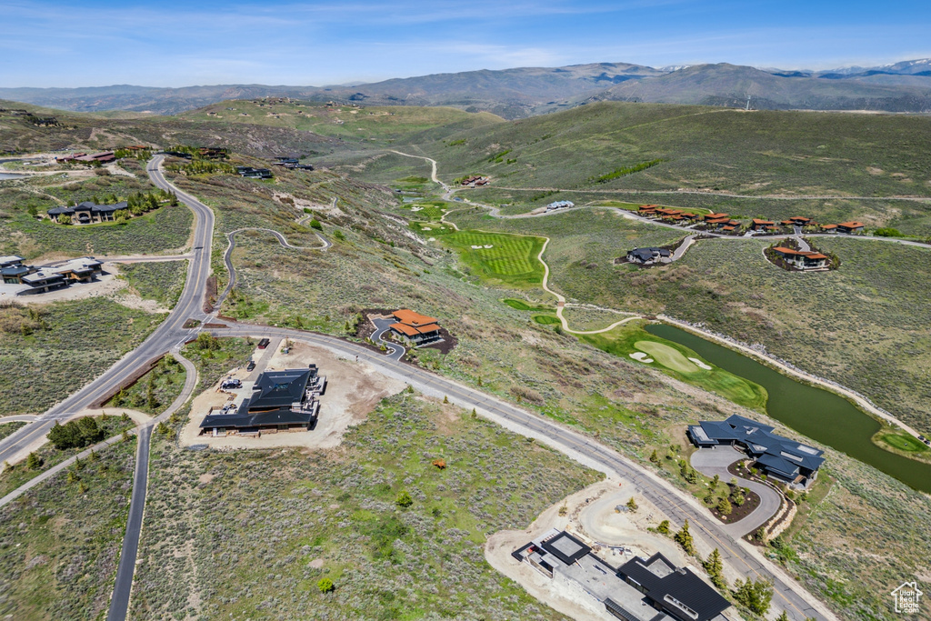 View of property location with a water and mountain view