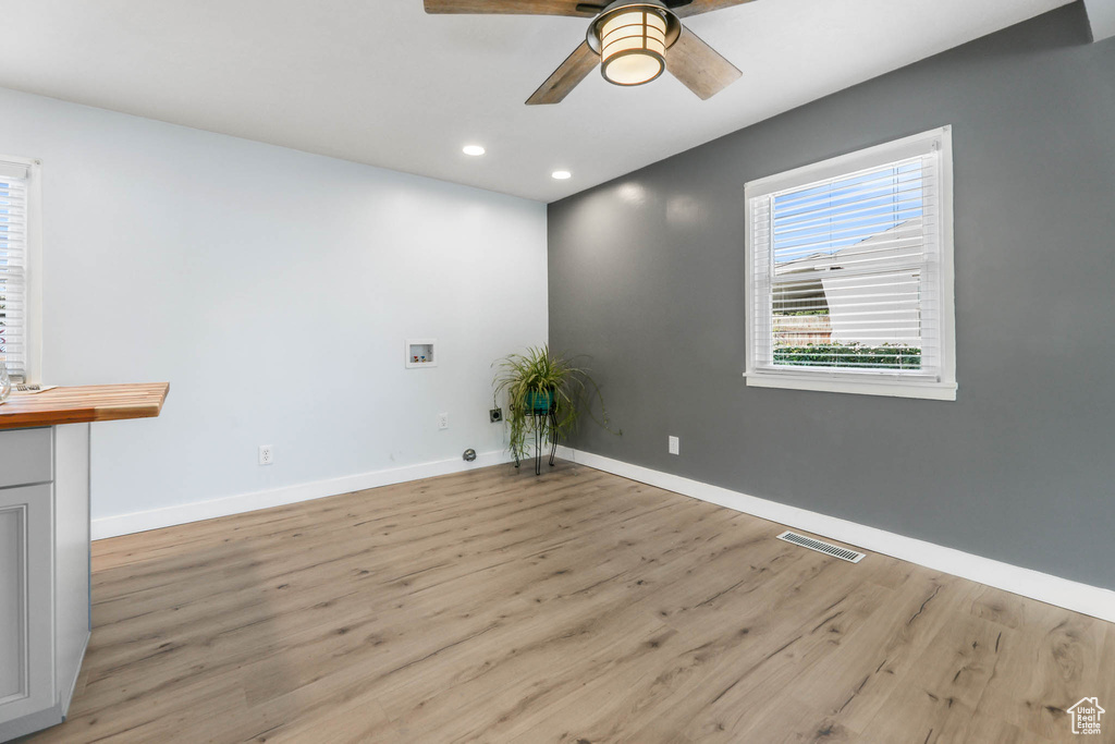 Spare room featuring ceiling fan, light wood-style flooring, and recessed lighting