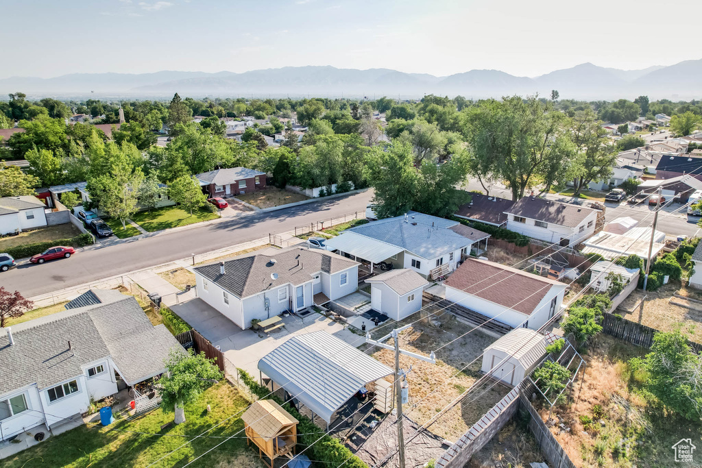 Aerial perspective of suburban area with a mountainous background