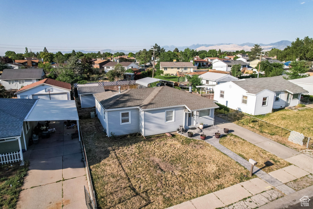 Aerial view of residential area featuring mountains