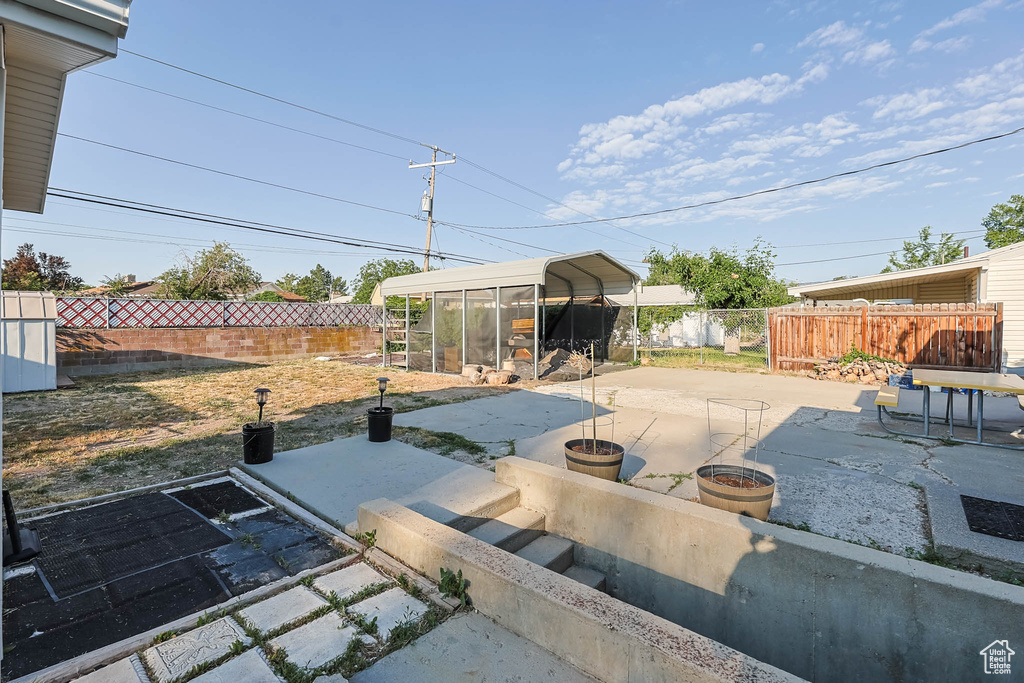 Fenced backyard featuring a patio area