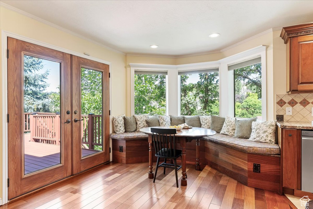 Sunroom / solarium with french doors and healthy amount of natural light