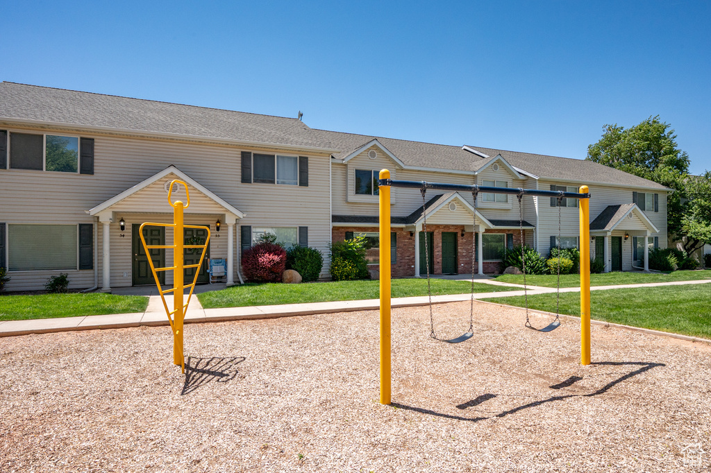 View of property with a front yard
