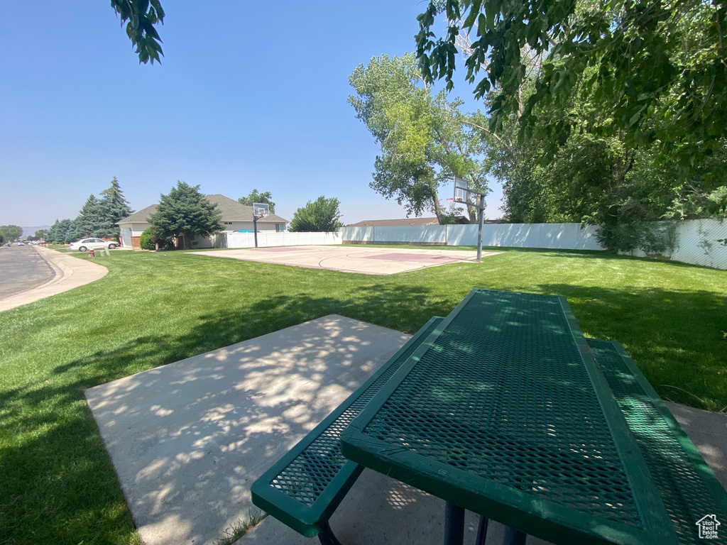 View of swimming pool with community basketball court