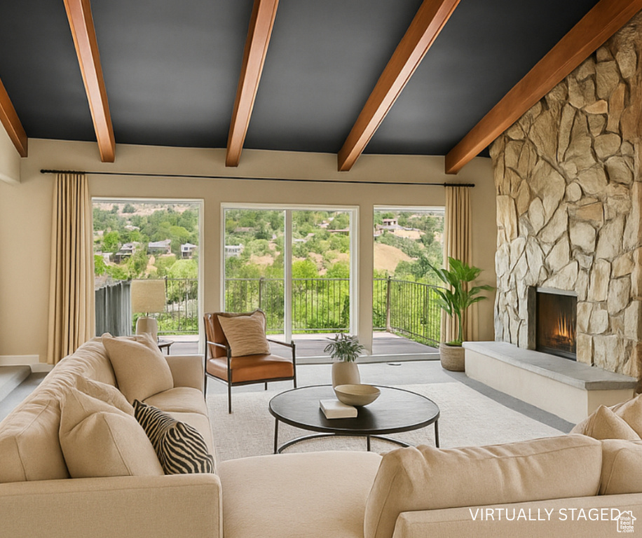 Living room featuring beam ceiling, a fireplace, and carpet flooring