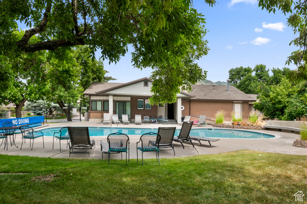 Community pool with a patio