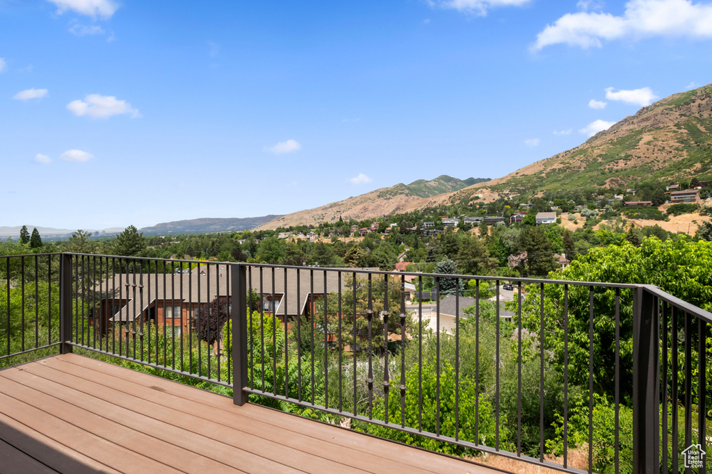 Wooden terrace featuring a mountain view