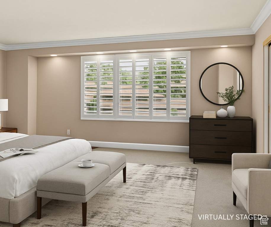 Bedroom featuring ornamental molding and carpet floors
