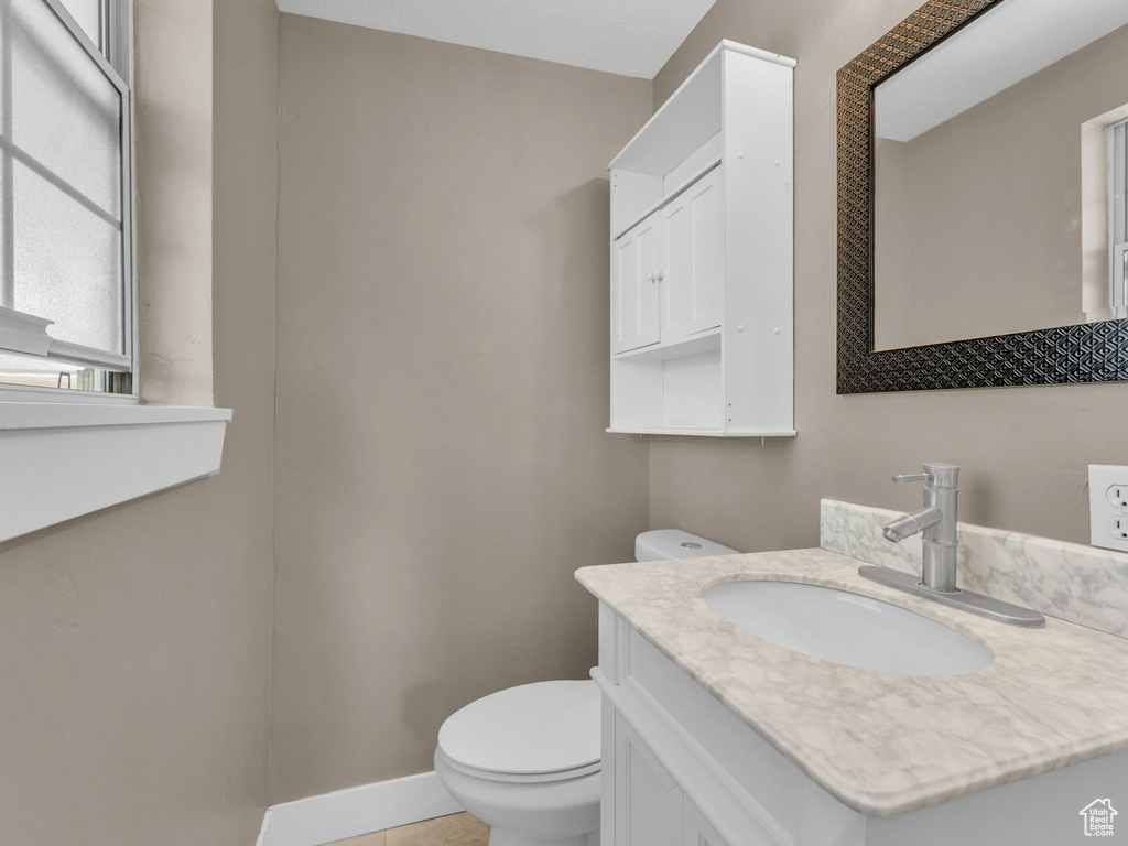 Bathroom with vanity and tile patterned floors