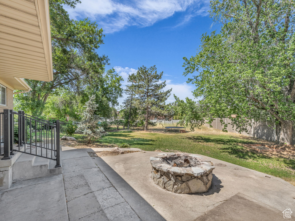 View of patio / terrace with an outdoor fire pit