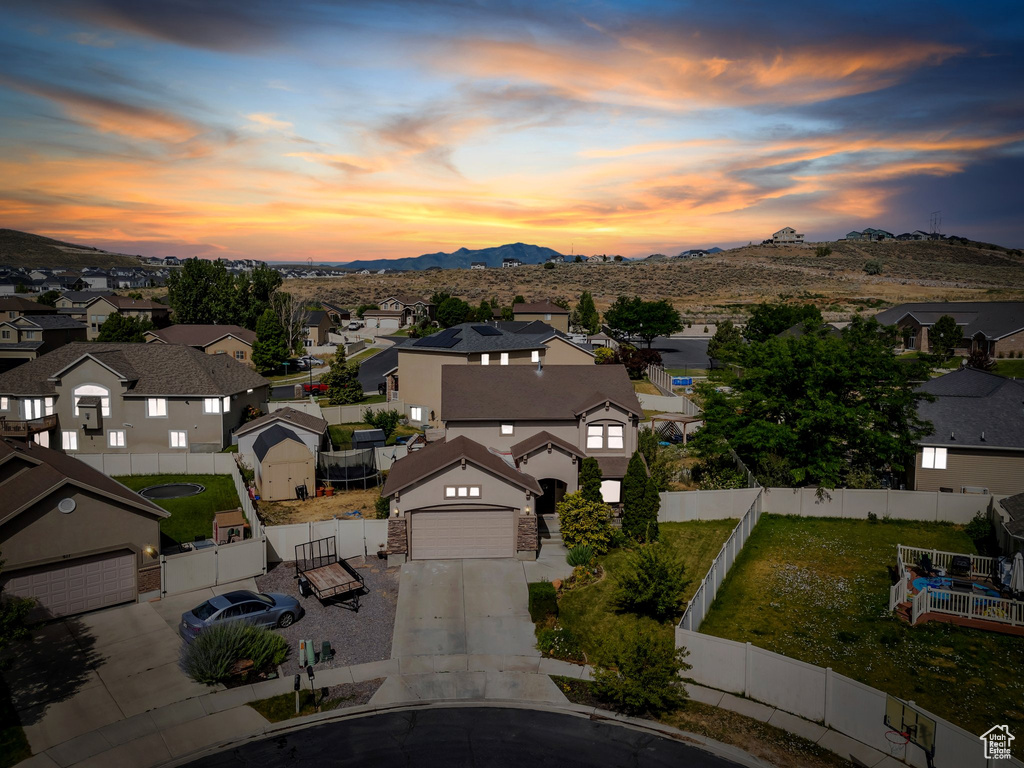Aerial perspective of suburban area featuring a mountainous background