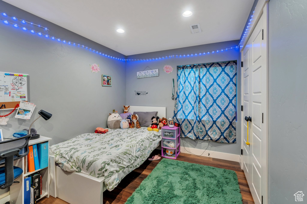Bedroom featuring wood finished floors and recessed lighting
