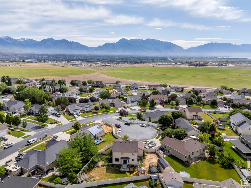 Aerial view of residential area with a mountainous background