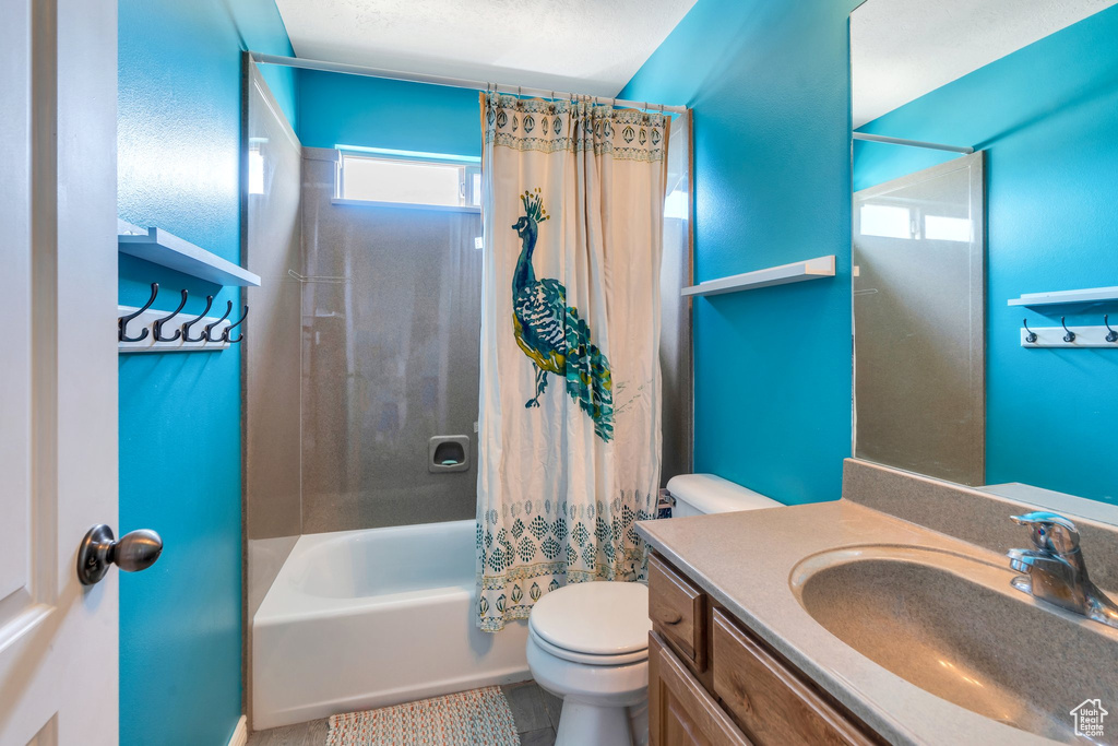 Bathroom with vanity and shower / bath combo