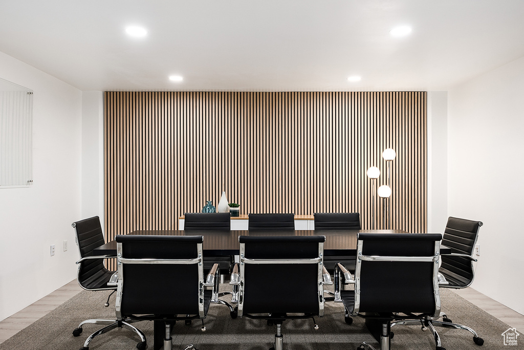 Office area featuring recessed lighting, wood finished floors, and an accent wall