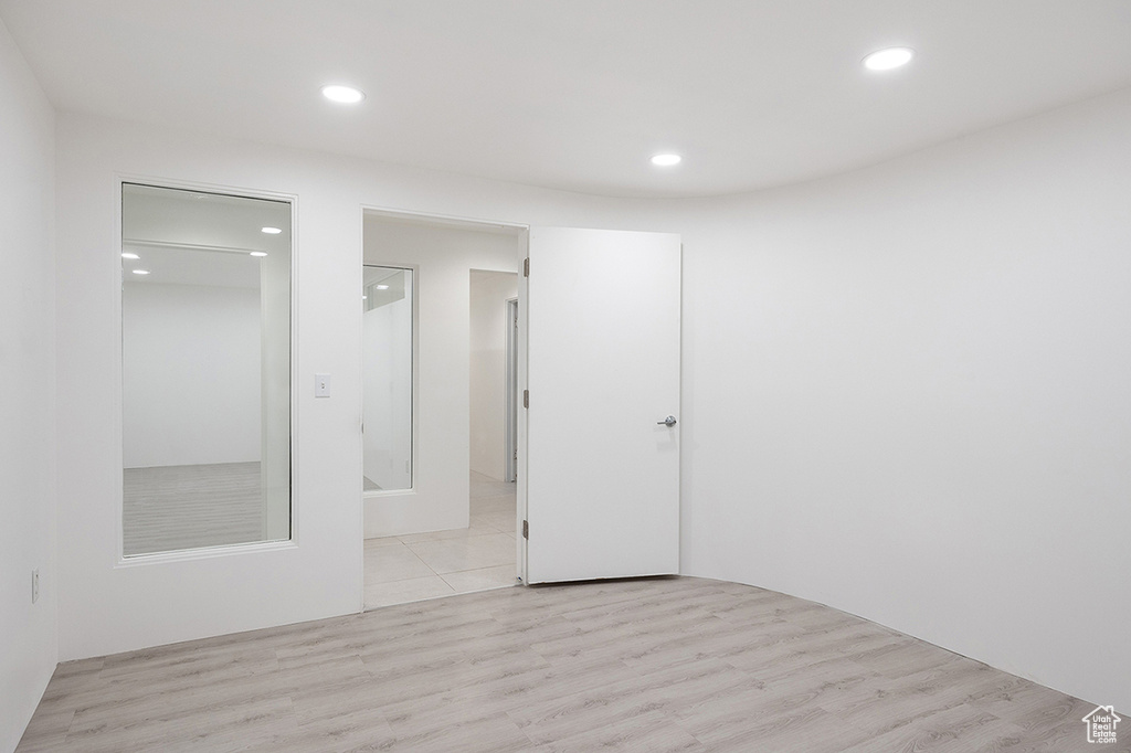 Empty room featuring recessed lighting and light wood finished floors
