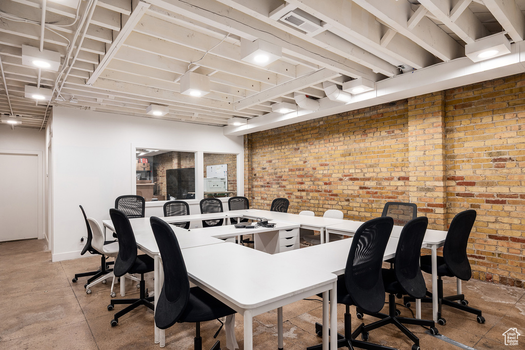 Office featuring brick wall