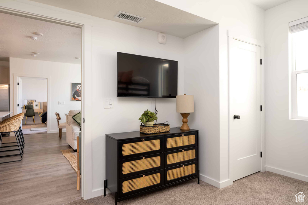 Corridor featuring baseboards