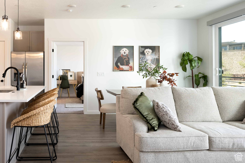 Living area featuring dark wood finished floors and baseboards
