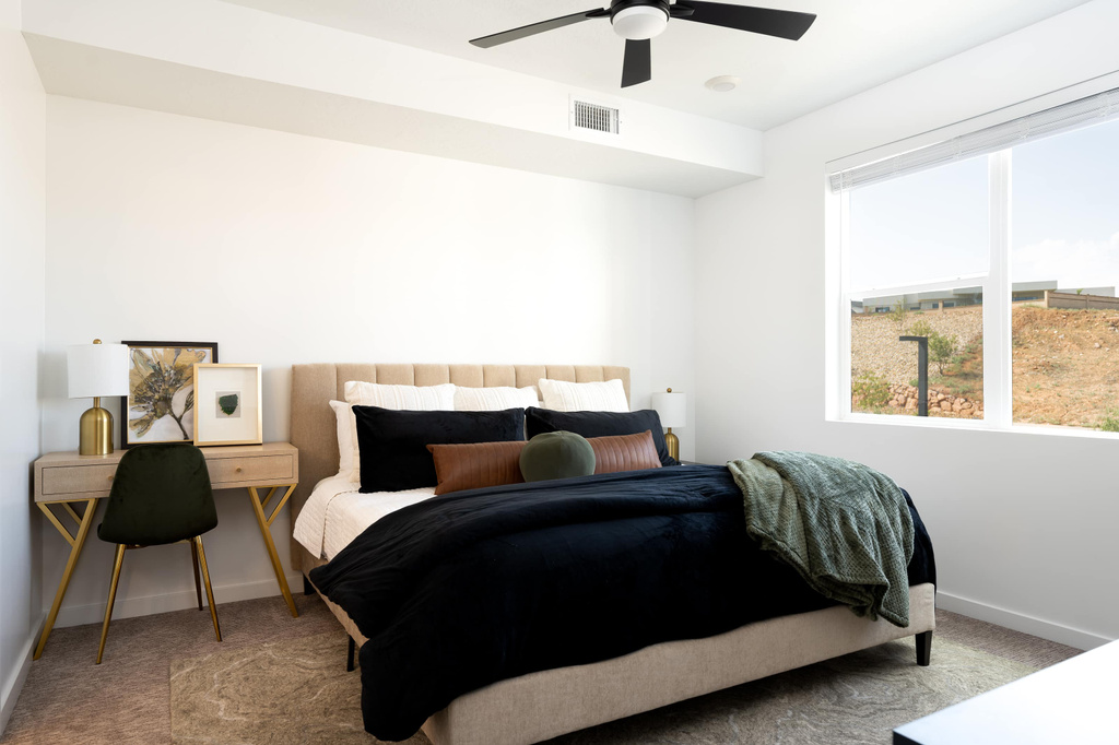 Bedroom with carpet and a ceiling fan