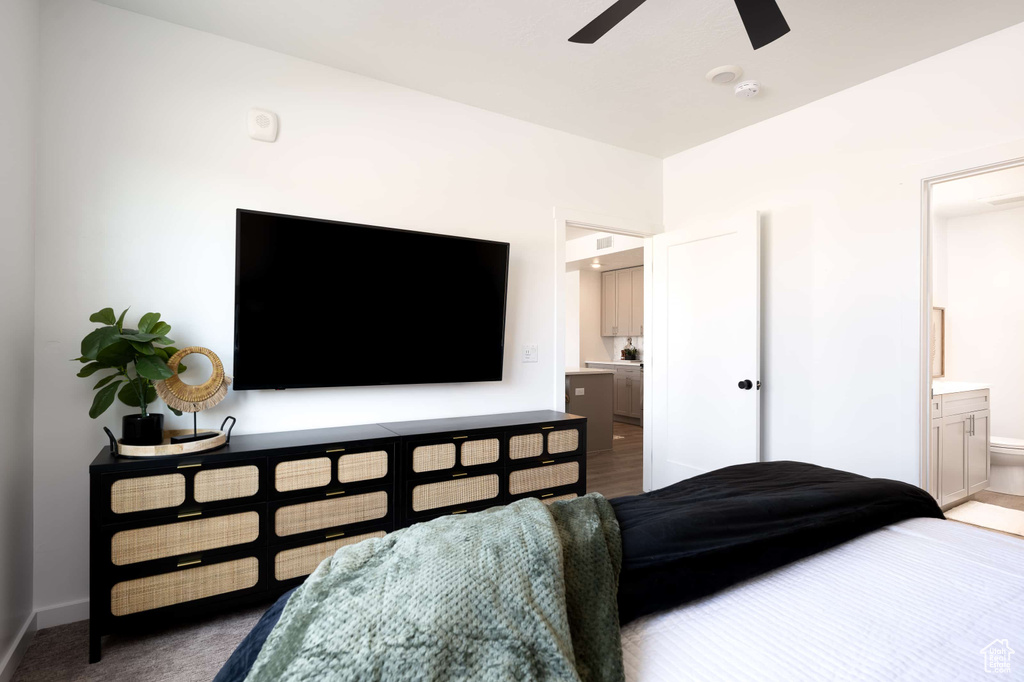 Bedroom featuring connected bathroom and ceiling fan