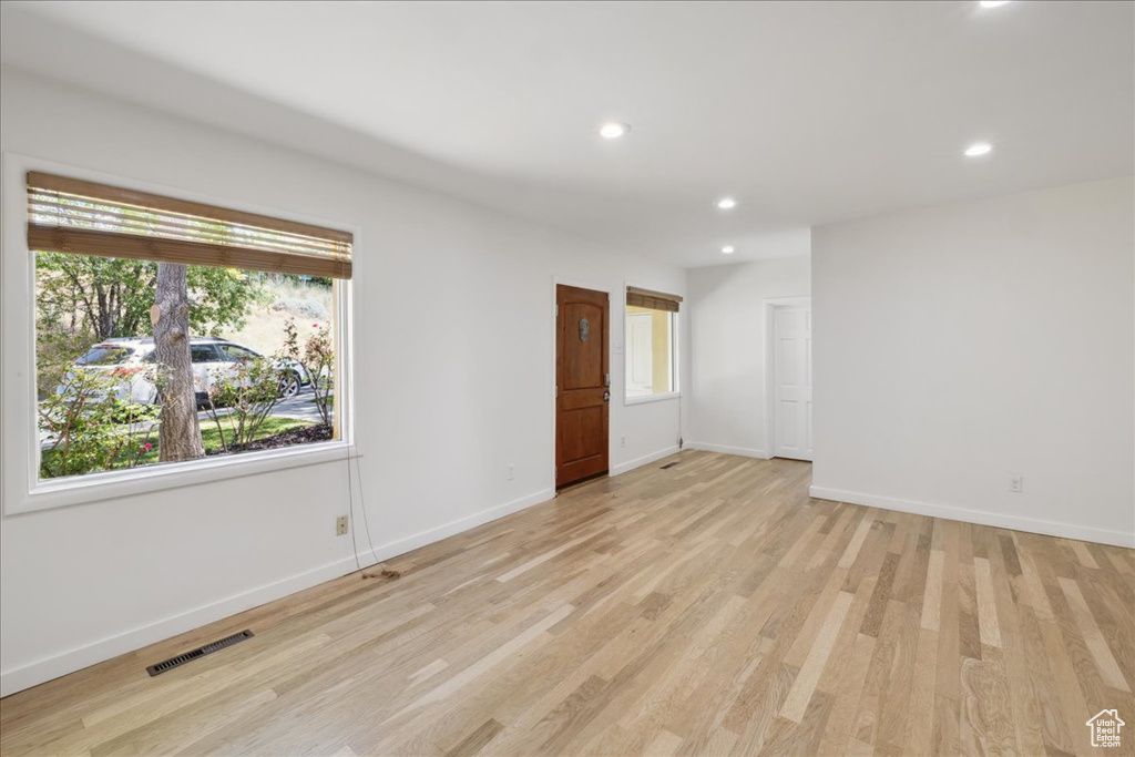 Spare room with recessed lighting and light wood-style flooring