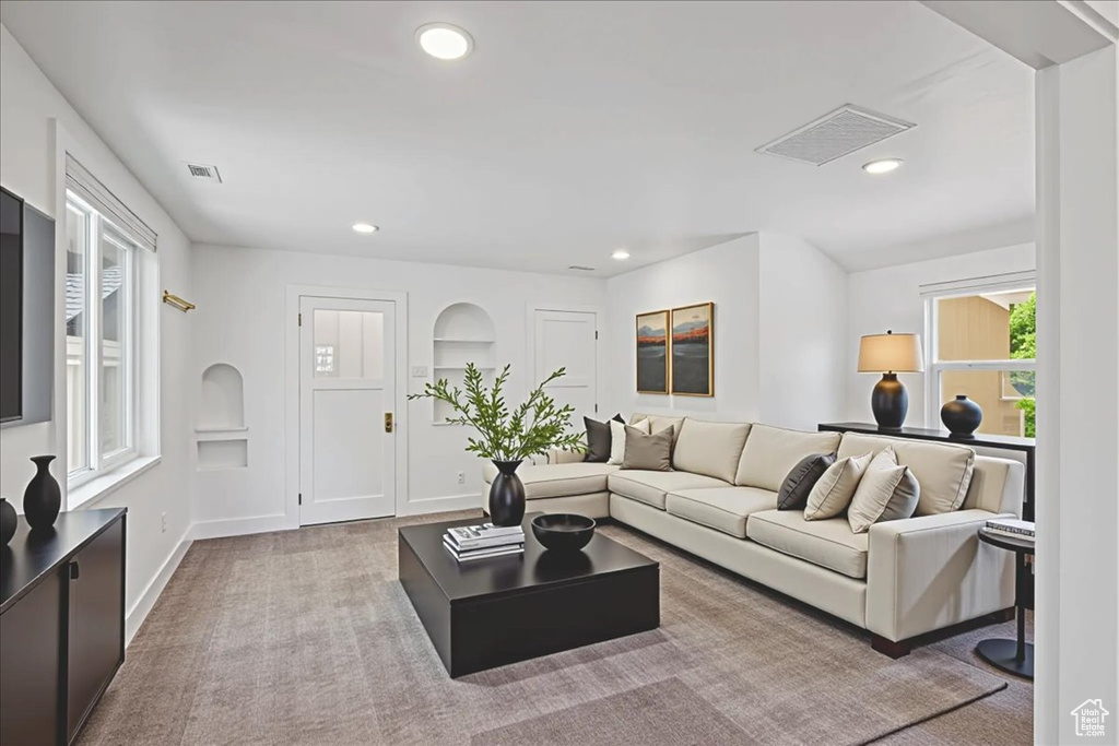 Living room featuring carpet and recessed lighting