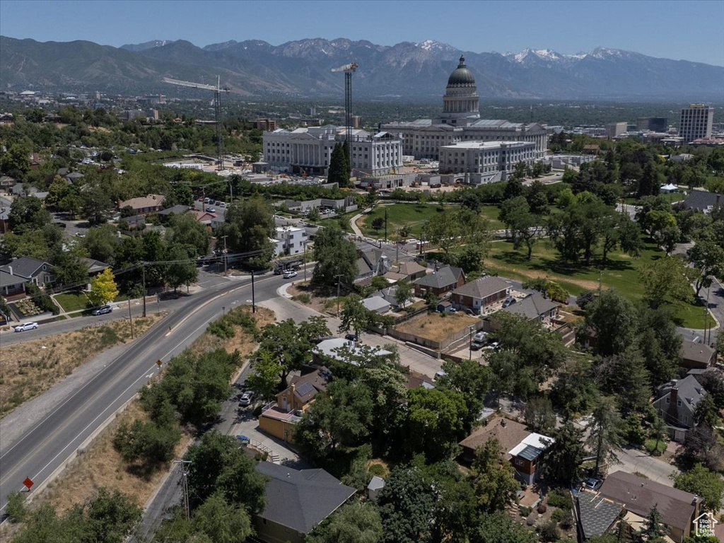 Aerial view of property\\\'s location with a mountainous background and nearby urban area