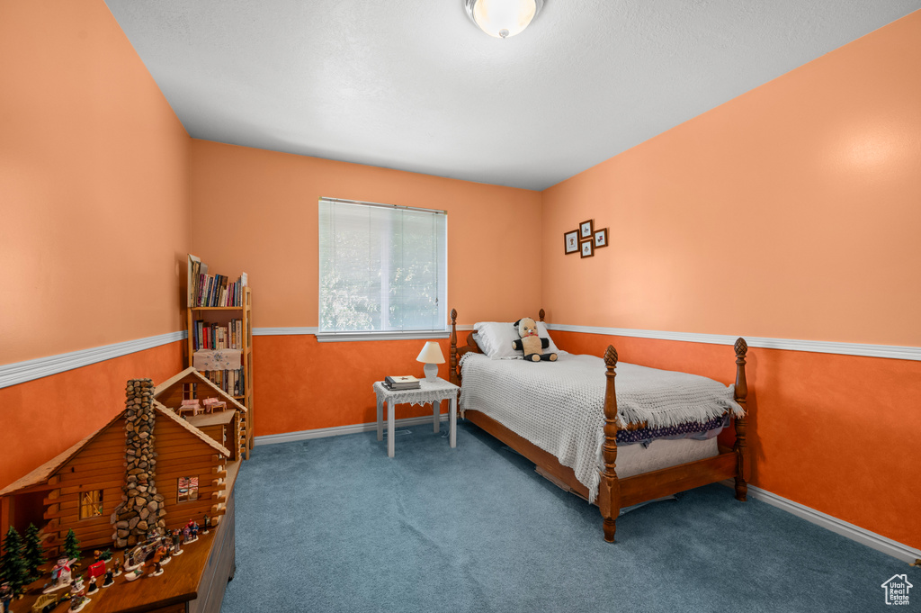 Carpeted bedroom with baseboards