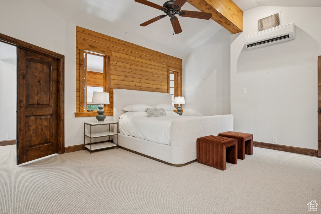 Bedroom with carpet floors, an AC wall unit, wooden walls, and ceiling fan