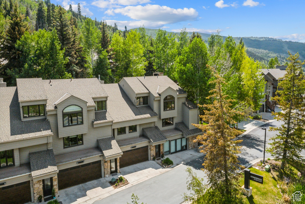 View of subject property featuring a mountainous background