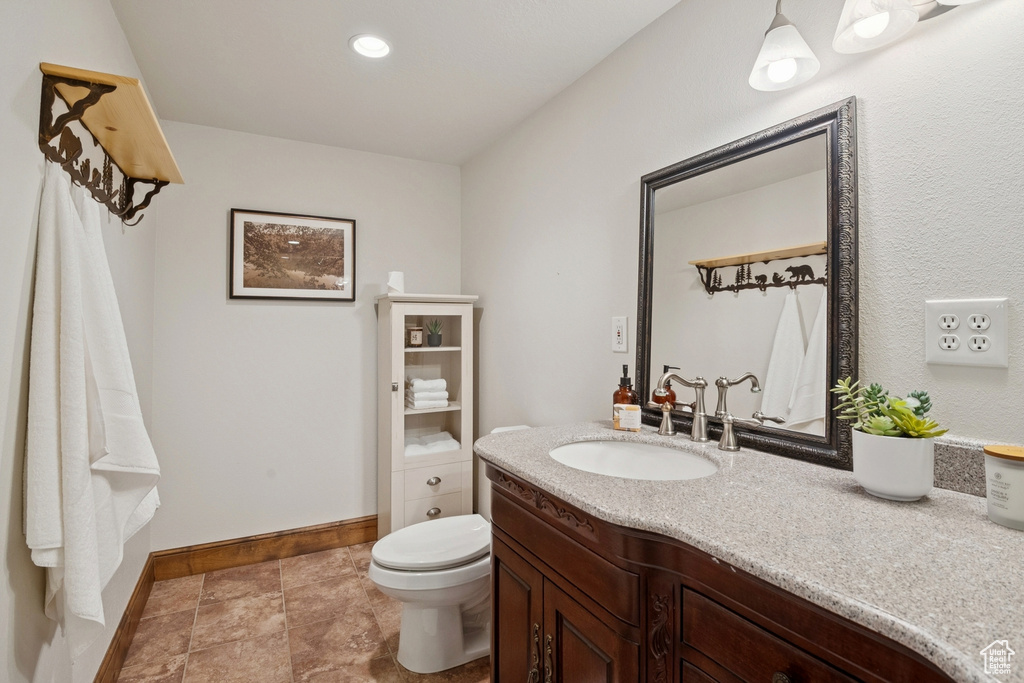 Bathroom featuring vanity and recessed lighting
