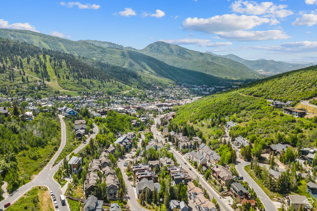 Aerial overview of property's location featuring mountains and nearby suburban area