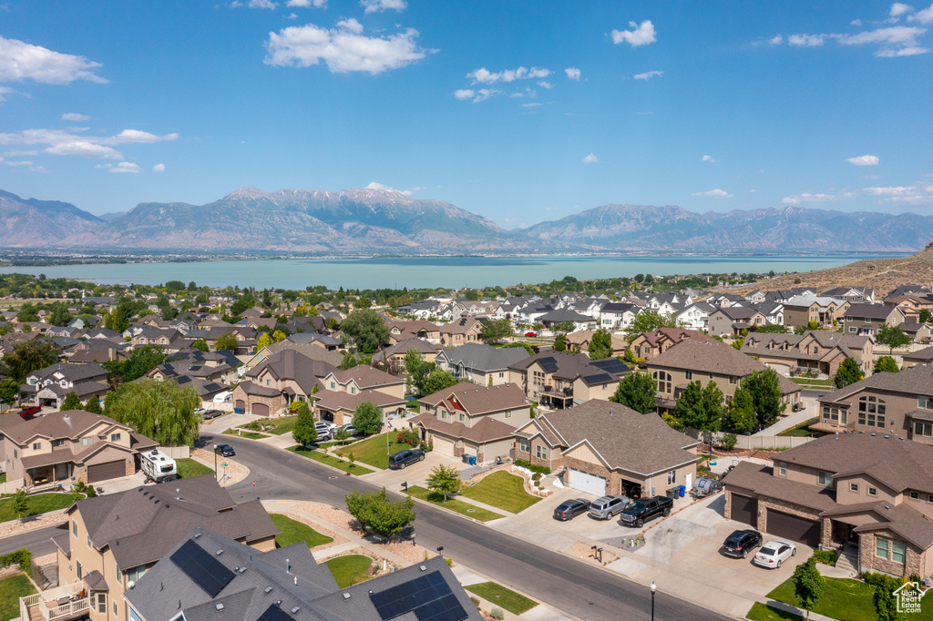 Aerial perspective of suburban area featuring a water and mountain view
