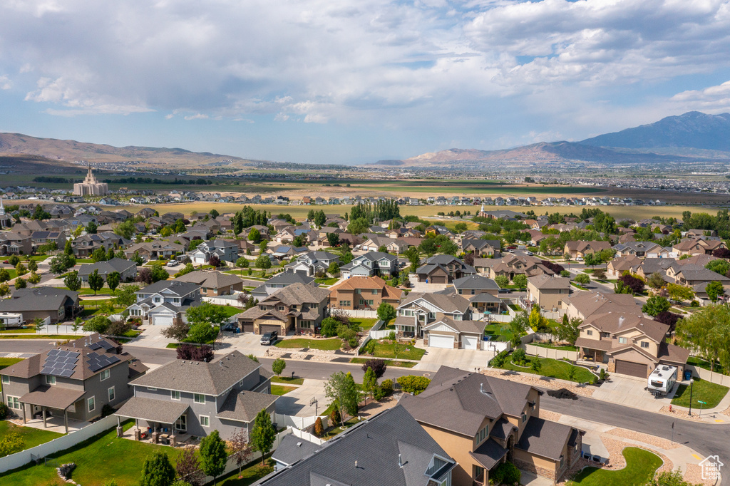 Aerial perspective of suburban area with a mountainous background