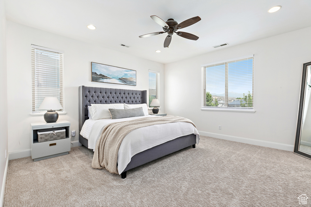Bedroom with recessed lighting, light carpet, and a ceiling fan