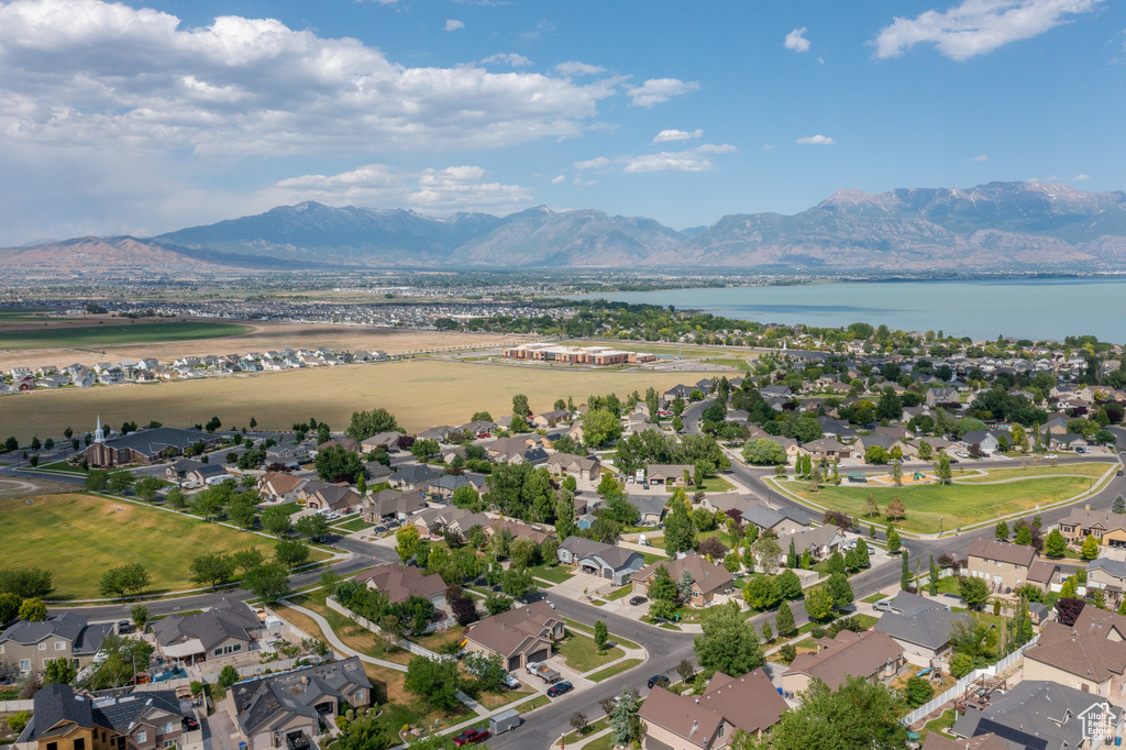 Aerial perspective of suburban area with a water and mountain view