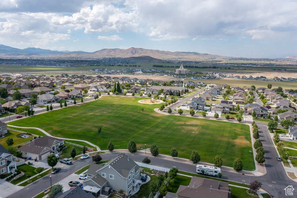 Aerial view of residential area featuring a mountain backdrop