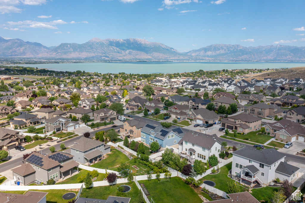 Aerial perspective of suburban area with a water and mountain view