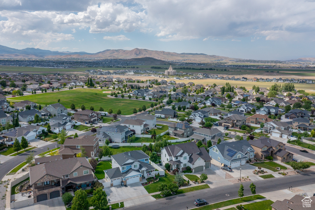 Aerial view of residential area featuring a mountainous background
