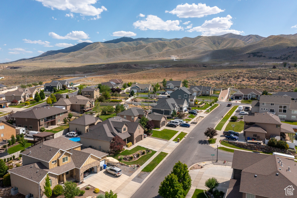 Aerial view of residential area featuring a mountain backdrop
