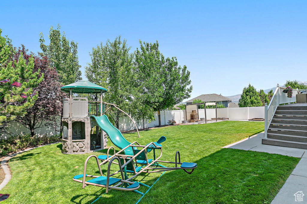 Fenced backyard with stairway