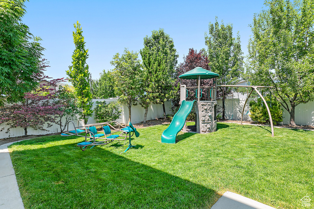 View of play area featuring a fenced backyard