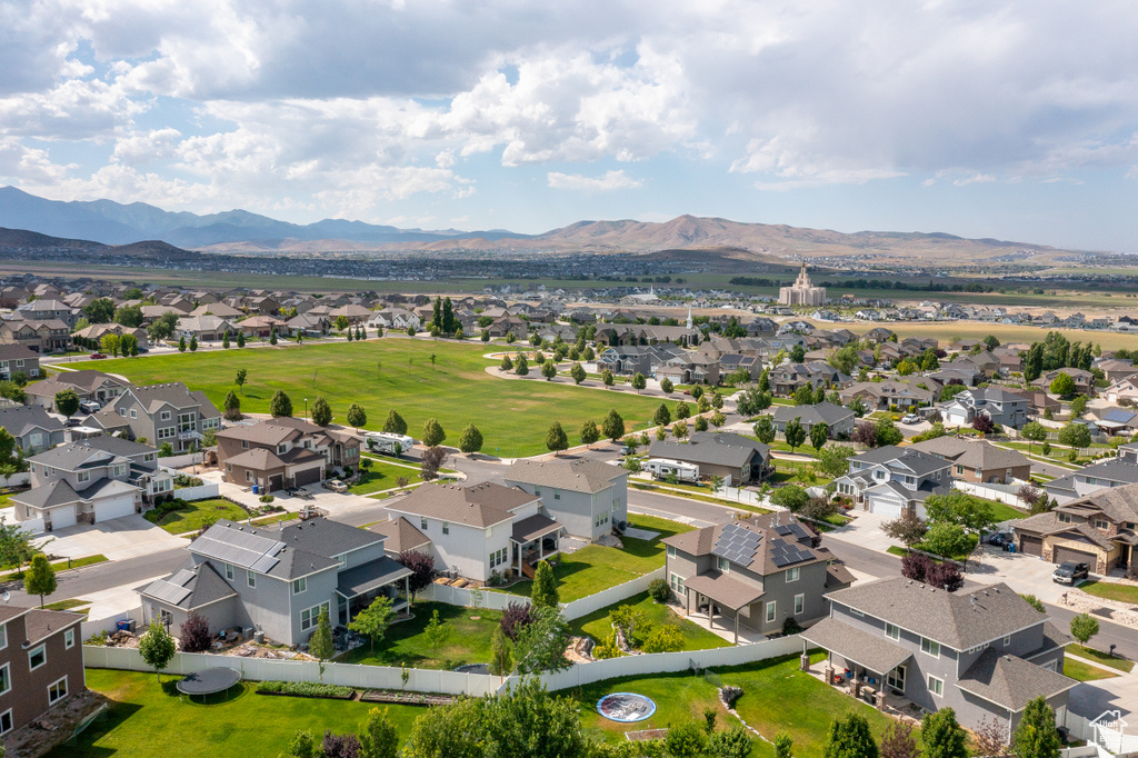 Aerial perspective of suburban area with a mountainous background