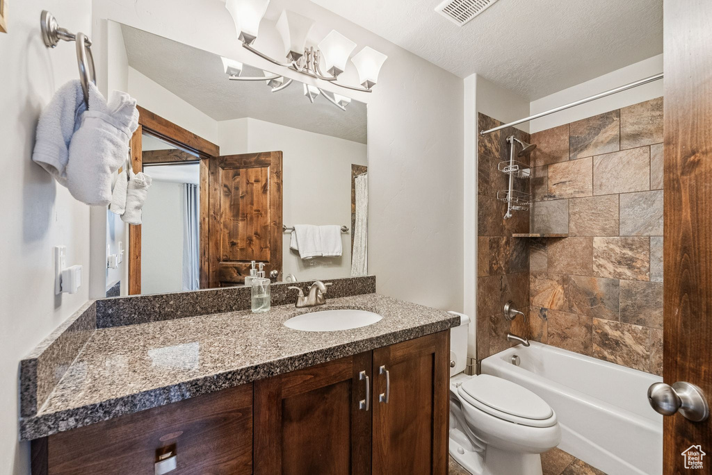 Full bathroom with vanity, shower / tub combination, and a chandelier
